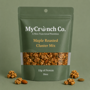 A 16oz forest green stand-up pouch of MyCrunch Co. Maple Roasted Cluster Mix against a solid green background, showing a clear window filled with nut-free granola clusters and scattered ingredients below.